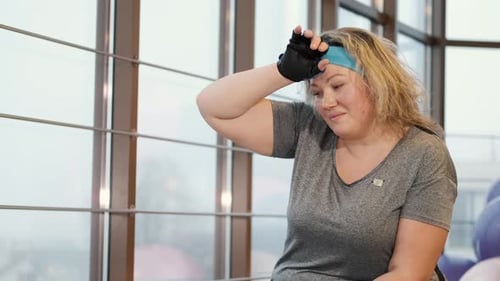 Exhausted Mature Woman After Workout Drink Water