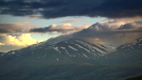Foggy Mountain Ridge in Spring at Sunset Times