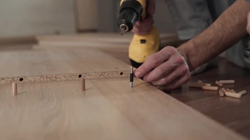 Man and Child Building Furniture Together