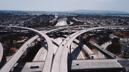 Static Drone Aerial Shot of Large Complex Highway Road Junction with Cars Moving Through Multiple