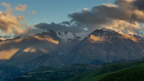 Majestic Mountains and Clouds at Colorful Sunset