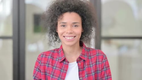 Smiling Woman Waving in a Close Up Shot