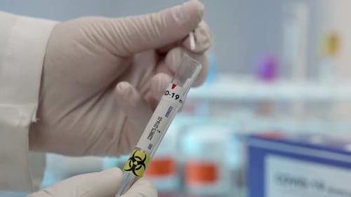 Close view of swab for covid-19 being sealed in tube