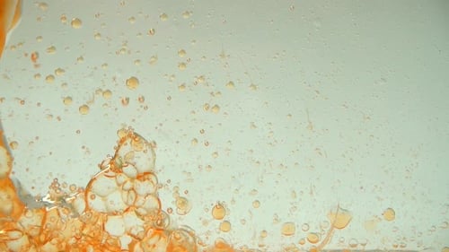 Abstract Orange Liquid Bubbles in Motion