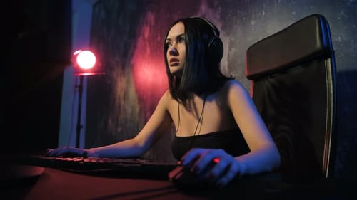 Woman Gamer Playing Video Game at Night