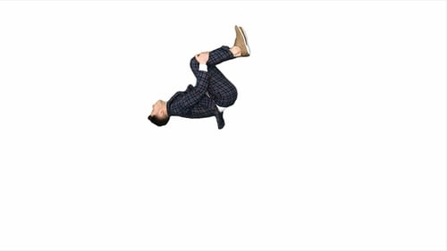 Businessman in suit makes back flip and shows thumb up