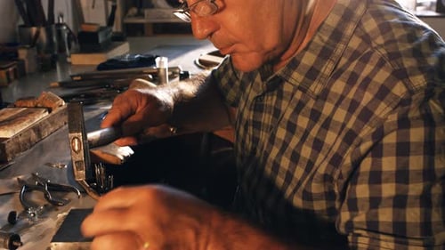 Goldsmith preparing ring