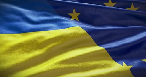 Waving Flags of Ukraine and European Union