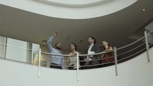 Businessman discussing building interior with clients