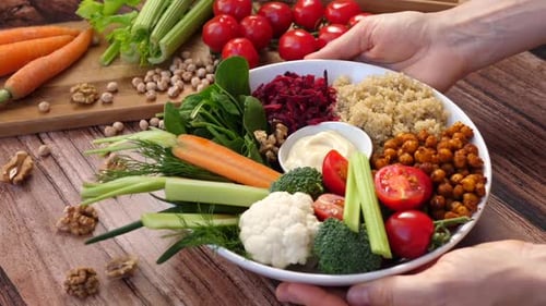 Colorful vegan bowl full of fresh vegetables