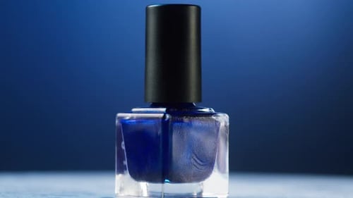 Close Up of Blue Nail Polish Bottle