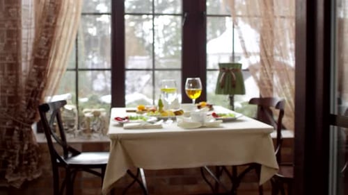 Healthy Breakfast for Two Laid out on Table by Window in Countryside Hotel