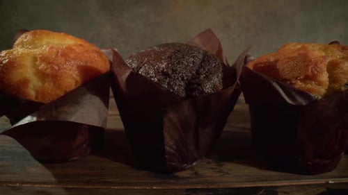 Close Up of Delicious Muffins on Wooden Surface