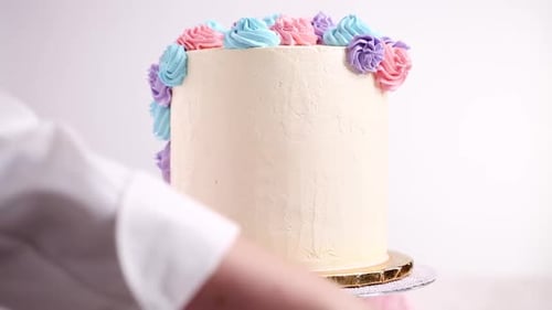 Cake Decorating with Pretty Pastel Frosting Flowers