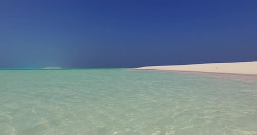 Natural fly over abstract view of a sandy white paradise beach and aqua blue ocean background in hi