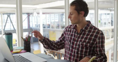 Young man working in a creative office