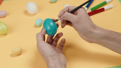 Painting Turquoise Easter Egg with Fine Brush