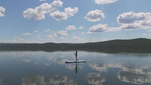 Sequence of Woman Paddling in Lake