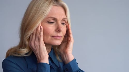 Tired Stressed Worried Middle Aged 50s Business Woman Suffering From Headache