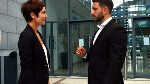 Businesspeople interacting while shaking hands
