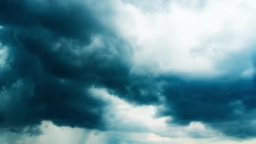 Dramatic Clouds Swirl Across the Sky