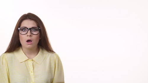 Woman Reacts with Surprise, Hands to Face