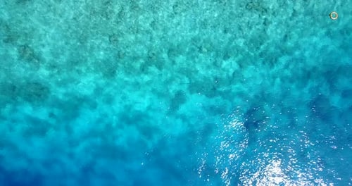 Beautiful birds eye abstract view of a sandy white paradise beach and aqua blue water background in