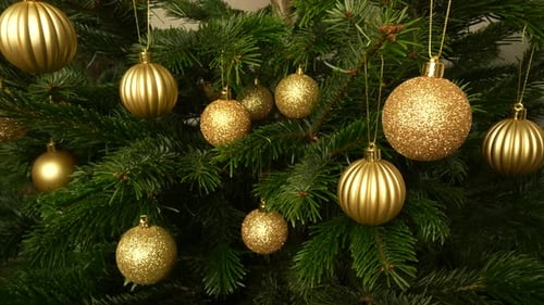 Festive Christmas Tree with Golden Holiday Ornaments