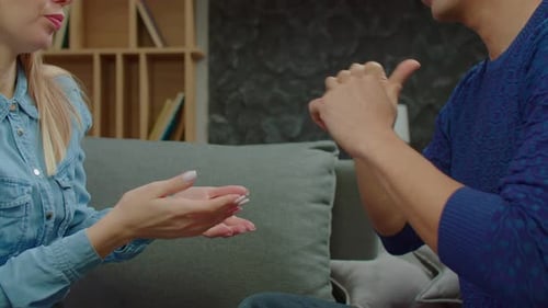Adults Communicating with Sign Language Indoors