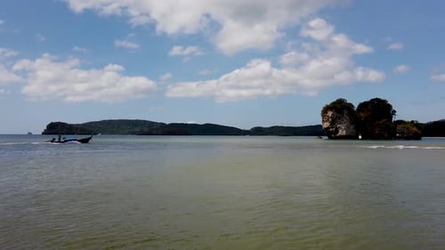 The beautiful beach in Krabi Thailand showing the calm ocean on a bright sunny day