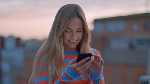 Young Millennial Woman Use Smartphone at Sunset