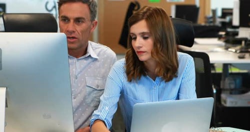 Colleagues Working Together in an Urban Office Setting