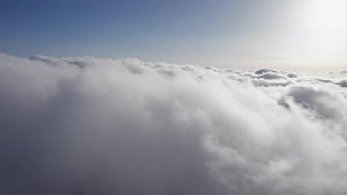 Aerial View Above the Clouds on Sunny Day