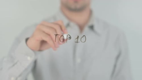 Man Writes Top 10 on Clear Surface
