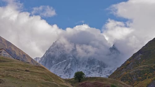 Majestic Mountain Range Covered in Clouds