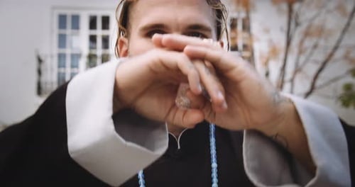 Man Performing Martial Arts Gesture To Camera