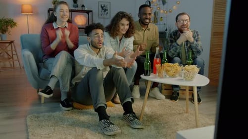 Friends Cheering and Celebrating Sports Game