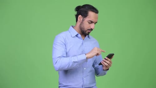 Man Using Cell Phone Looks Confused