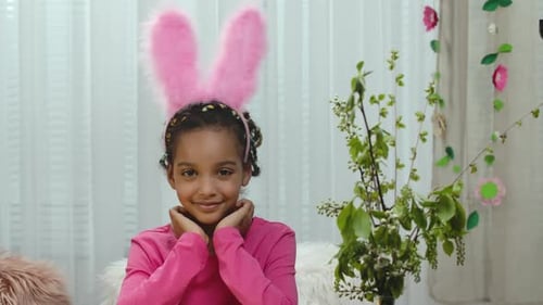 Smiling Girl with Pink Bunny Ears Poses