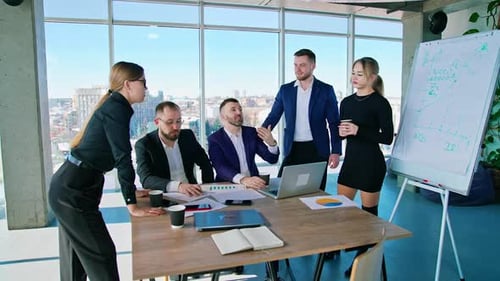 Team Discussing Data and Planning in Modern Office