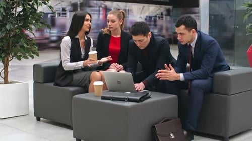 Business People Interacting in Lobby