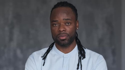 Man With Dreadlocks Portrait Against Gray Background