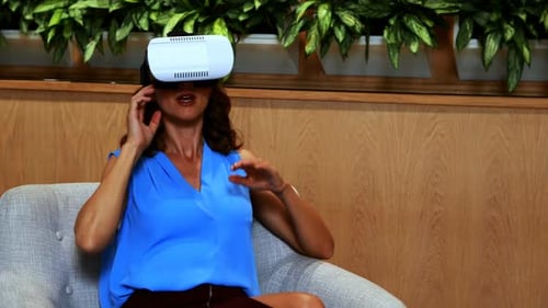 Woman Uses VR Headset in Modern Office