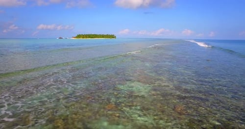 Aerial drone view of a scenic tropical island in the Maldives.