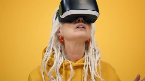 Senior Woman Enjoys a Virtual Reality Headset Experience