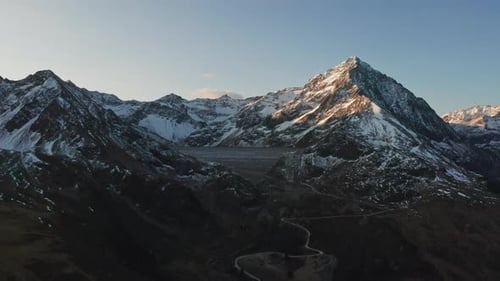 Beautiful Landscape Aerial Shot of Mountains with Snow on Its Peak