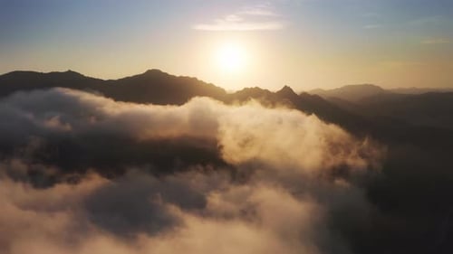 Aerial View of Majestic Mountains at Sunrise