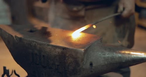 Blacksmith Shaping Heated Steel at the Anvil