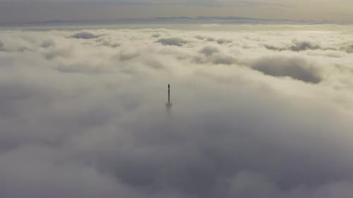 Aerial View of the Upper Part of the Broadcasting Tower in the Fog