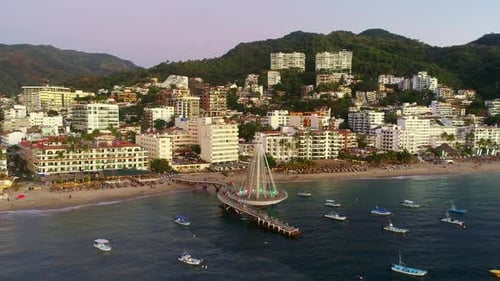 Coastal Cityscape with Pier at Sunrise